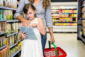 Mother and daughter using tablet