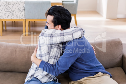 Gay couple hugging each other