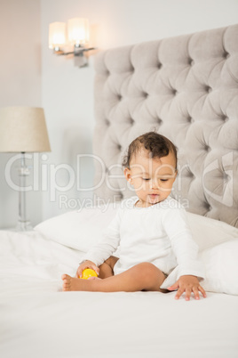 Cute baby playing with ball