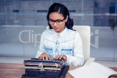 Asian woman typewriting