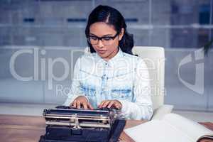 Asian woman typewriting