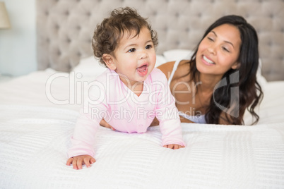 Brunette playing with her baby