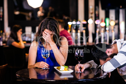 Couple laughing and having a drink