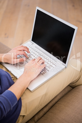 Man typing on a laptop