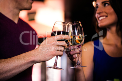 Couple toasting with a glass of wine