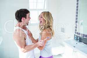Happy couple being excited with positive pregnancy test