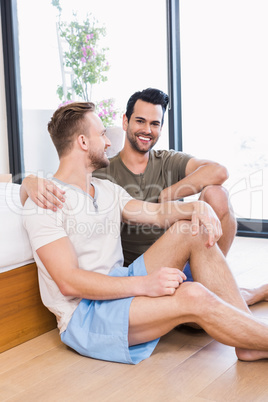 Happy gay couple looking at each other