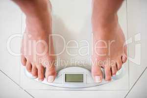 Feet of woman on weighting scale