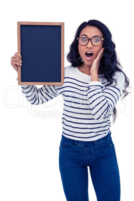 Surprised Asian woman holding blackboard