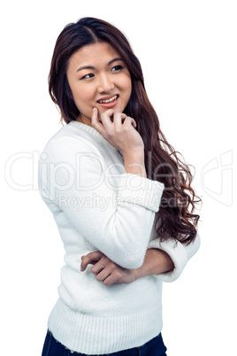 Smiling Asian woman with hand on chin