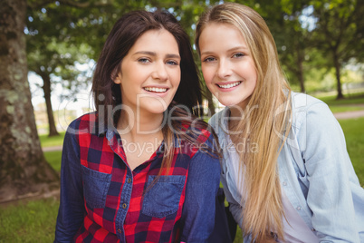 Smiling females students posing