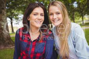 Smiling females students posing