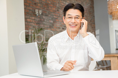 Smiling man on a phone call