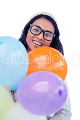 Asian woman holding colorful balloons