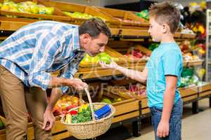 Father and son doing shopping