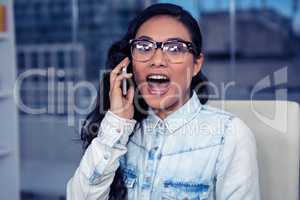 Asian woman shouting on phone call