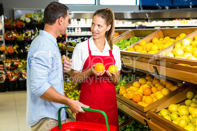 Man and worker discussing fruit