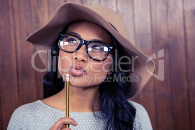 Asian woman holding pencil