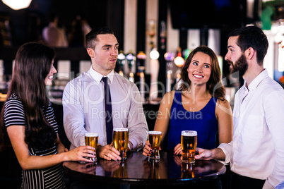 Friends talking and having a beer