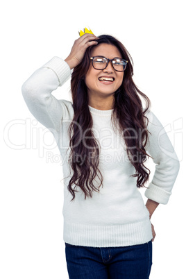 Asian woman with paper crown posing for the camera