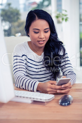 Attractive Asian woman using smartphone