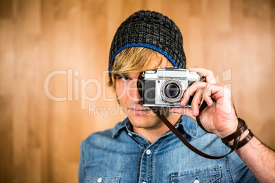 Serious hipster man taking picture