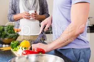 Mid section of gay couple preparing food