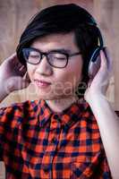Hipster listening music with headphone