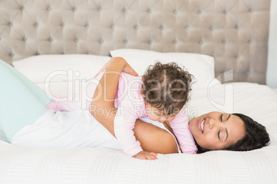 Brunette playing with her baby