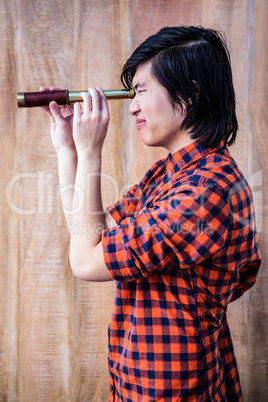 Hipster looking through a telescope