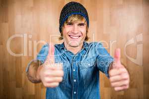 Smiling hipster with thumbs up