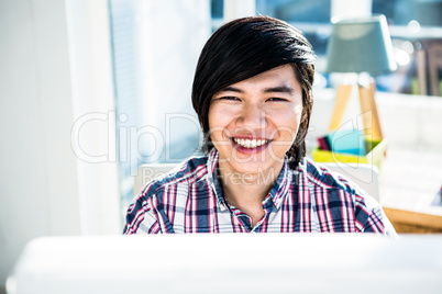 Smiling hipster businessman looking at camera