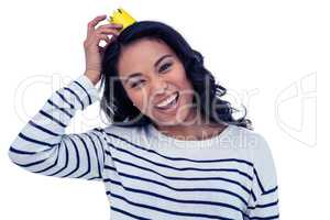 Smiling Asian woman with paper crown