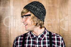 Side view of Happy blond hipster smiling