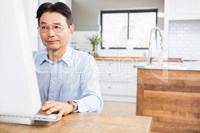 Concentrated man using computer