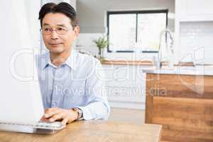 Concentrated man using computer