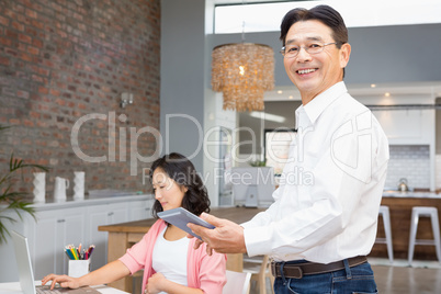 Happy man using tablet