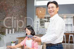 Happy man using tablet