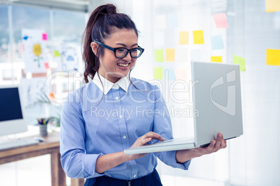 Asian businesswoman using laptop