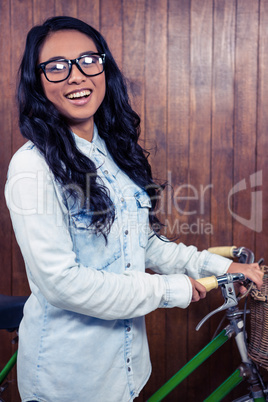 Asian woman holding bike