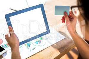 Cropped image of hipster businessman using tablet and credit car