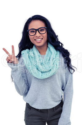 Asian woman making peace sign with hand