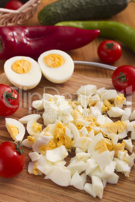 Kitchen board with finely chopped eggs