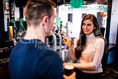 Smiling couple having a drink together