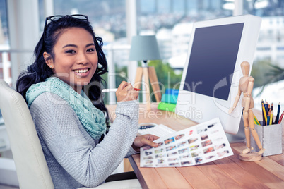 Asian businesswoman holding paper sheet