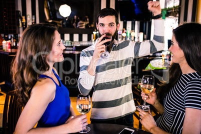 Group of friends having a glass of wine