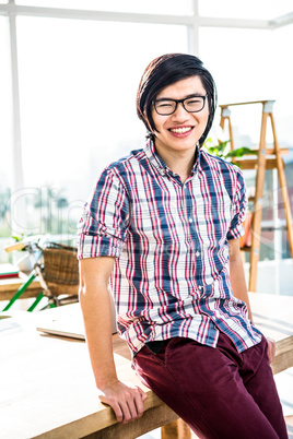 Smiling hipster businessman posing for camera