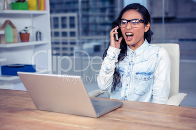 Asian woman shouting on phone call