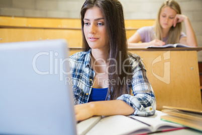 Smiling students working in class