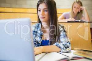 Smiling students working in class